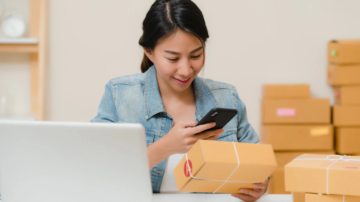 Small business owner packing online orders with a phone and laptop