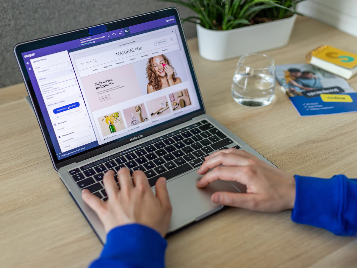 Person editing an online store on a laptop